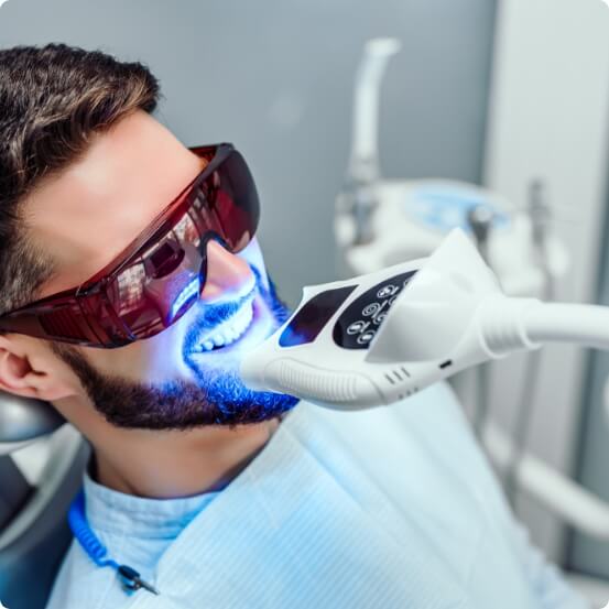 Man receiving professional teeth whitening