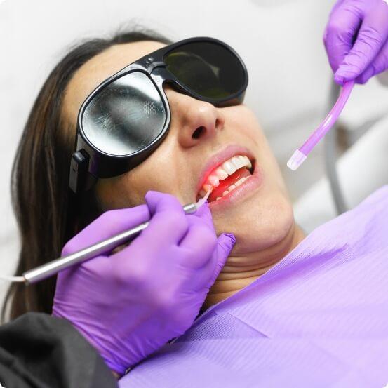 Dental patient receiving laser periodontal therapy